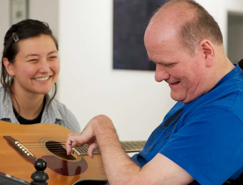 Disabled man playing guitar