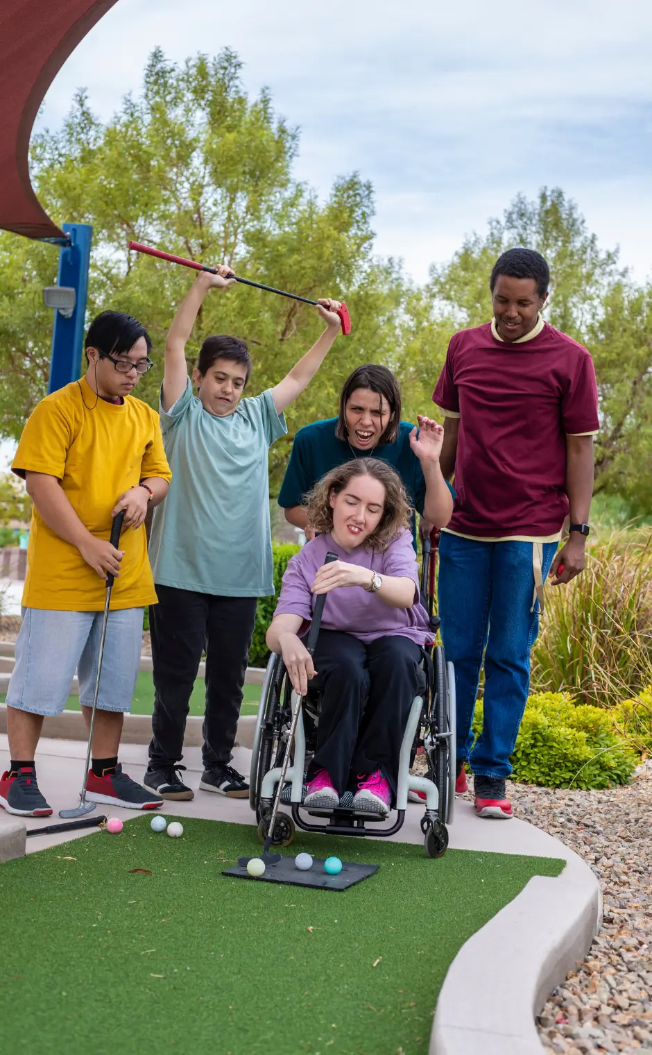 group playing mini golf