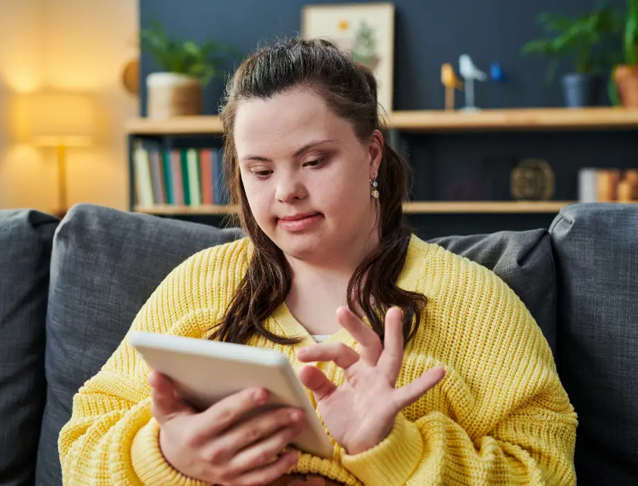 Young disabled girl using a tablet